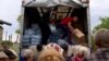 GRAB Ukrainians Brave Russian Attacks To Get Supplies To Flood-Stricken Villages