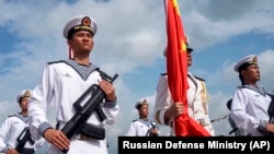 Chinese and Russian naval forces conduct joint exercises near Zhanjiang, China, on July 15.