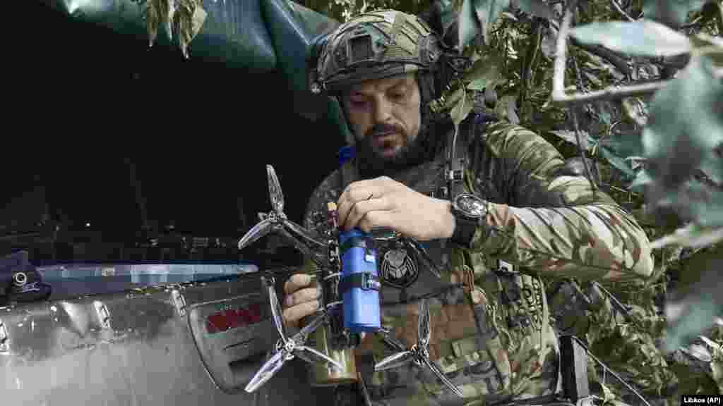 A Ukrainian soldier prepares a drone near the front in the Zaporizhzhya region on July 1. Both sides have increased their use of drones in combat operations. 