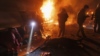 Ukrainian first responders work at the scene of an overnight drone attack in Kharkiv on April 4. Air defenses are an increasing priority for Kyiv.