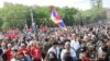 Armenia - An opposition supporter waves the Karabakh flag during an anti-government rally in Yerevan, May 1, 2022.