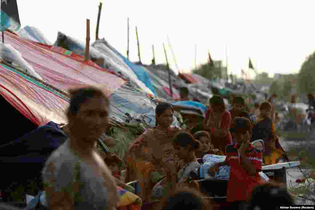 Flood victims stand next to their tents in Mehar on August 29. UN Secretary-General Antonio Guterres urged the world to come to Pakistan's aid as he launched a $160 million appeal to help the tens of millions affected by the disaster. "Let's stop sleepwalking towards the destruction of our planet by climate change. Today, it's Pakistan. Tomorrow, it could be your country," he said. 