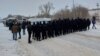 A police quick-reaction unit cordons off the road at a rally in Oral on January 4.