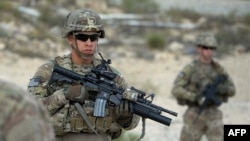 FILE: U.S. soldiers patrol during a month-long anti-Taliban operation by the Afghan National Army.