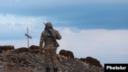 An Armenian soldier near military positions along the border with Azerbaijan (file photo). 