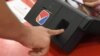A voter goes through a fingerprint authentification process in Armenia’s elections (file photo)