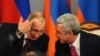Armenia -- Russian President Vladimir Putin (L) speaks with his Armenian counterpart Serzh Sarkisian during a signing ceremony in Yerevan, December 2, 2013