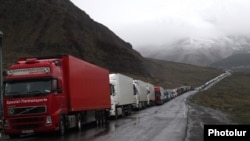 Georgia - Armenian heavy trucks are lined up on a road leading to the Georgian-Russian border crossing at Upper Lars, 6May2016.