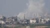 Smoke rises following an Israeli air strike in the Gaza Strip, as seen from southern Israel, on October 28.