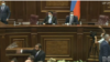 Pro-government and opposition lawmakers threw water battles at each other during a brawl in the Armenian parliament on August 25, 2021 