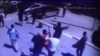 Момент одного из нападений предполагаемых боевиков в Актобе 5 июня 2016 года. Кадр видео. 