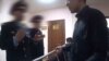 Скриншот видеозаписи разговора адвоката Бауыржана Азанова с полицейскими в здании суда в Астане. 