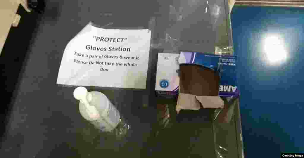 Hand sanitizer and an empty box of rubber gloves. Such stations are dotted throughout the vessel. 