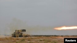 Iraq -- A Russian-made multiple rocket launcher known as the TOS-1A fires during training at a military camp in Baghdad October 14, 2014.