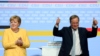 Angela Merkel és Armin Laschet a CDU/CSU kampányindító rendezvényén a berlini Tempodromban, 2021. augusztus 21-én