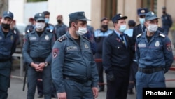Armenia -- Riot police guard a court building in Yerevan during the trial of former President Robert Kocharian and three other former officials, May 13, 2020.
