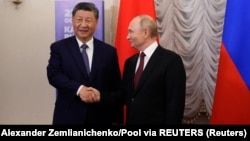 Претседателите на Кина и Русија, Си Џинпинг и Владимир Путин, на состанок за време на самитот на БРИКС, Казан, 22 октомври 2024 година.