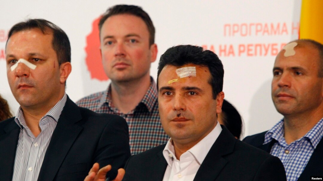 Macedonian Social Democratic leader Zoran Zaev (second from right) and other members of his party injured in the April 27 violence speak to reporters in Skopje on April 28.