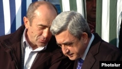 Armenia - President Serzh Sarkisian (R) and his predecessor Robert Kocharian at an official ceremony outside Yerevan, 01Dec2008.