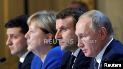 Paris, 9 decembrie 2019: summitul „formatului Normandia” pentru reglementarea conflictului din estul Ucrainei: cancelara germană Angela Merkel și președinții Ucrainei, Franței și Rusiei, Vlodimir Zelenski, Emmanuel Macron și Vladimir Putin.