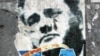 Serbia - A ripped poster of former Yugoslav President Slobodan Milosevic is seen in central Belgrade, 05 October 2005