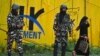 Indian security personnel stand guard near a closed school in Srinagar on August 19.