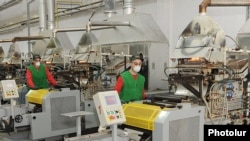 Armenia -- Workers at a manufacturing enterprise in Yerevan.