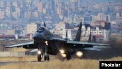 Armenia - A Russian MiG-29 fighter jet takes off from the Erebuni airbase in Yerevan, 14Mar2014.