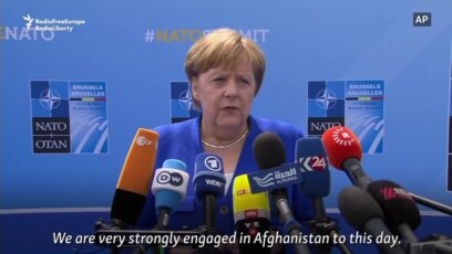 Merkel Defends Germany's NATO Record