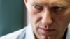 RUSSIA -- Russian opposition leader Aleksei Navalny stands during a break in the hearing on his appeal in a court in Moscow, September 5, 2018