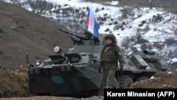 NAGORNO-KARABAKH -- Russian soldiers of the peacekeeping force man a checkpoint on a road outside the city of Stepanakert, November 26, 2020