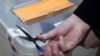 Armenia - An official opens a ballot box after the end of voting in a constitutional referendum, Yerevan, 6Dec2015.