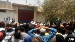 FILE: Pakistani protesters gather outside a police station during a demonstration against a Hindu man charged with blasphemy in southwest Balochistan Province in May 2017.