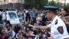Armenia -- Valeri Osipian, a deputy chief of the Yerevan police, urges protesters to unblock a street, Yerevan, 14 July, 2015 