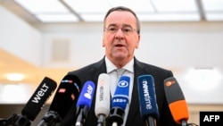 German Defense Minister Boris Pistorius talks to journalists on March 3 following the apparent leak of a confidential call between high-ranking military officers.