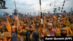 Supporters of Jamiat Ulema-e Islam shout slogans during an anti-government march in Islamabad on November 13.