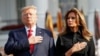 U.S. President Donald Trump and first lady Melania Trump observe a moment of silence to mark the 18th anniversary of the September 11 attacks on the South Lawn of the White House in Washington.