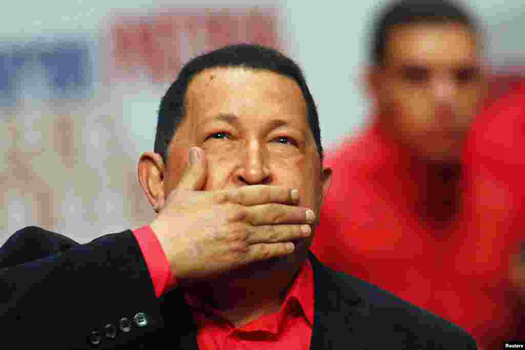 Venezuelan President Hugo Chavez blows a kiss as he arrives at a rally with supporters in Caracas in February 2012, before flying to Cuba for a new round of cancer surgery.