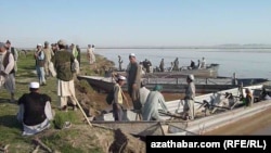 FILE: The border between Afghanistan and Turkmenistan is partly marked by the Amu Darya River in Qarqeen district of Jowzjan province.