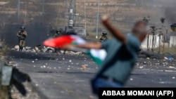 Përleshjet mes palestinezëve dhe forcave izraelite në Ramallah. Fotografi nga arkivi. 