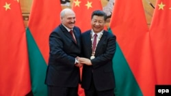 Belarusian President Alyaksandr Lukashenka (left) meets with China's President Xi Jinping on the sidelines of the Shanghai Cooperation Organization leaders' summit in Samarkand, Uzbekistan, in September.