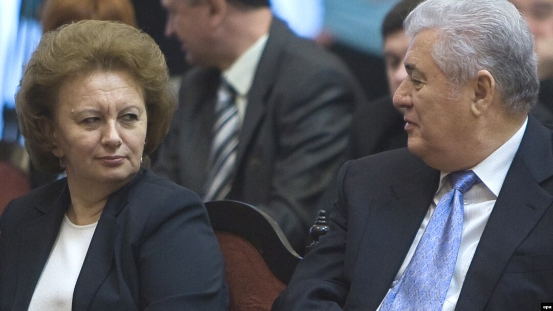 Communist leader Vladimir Voronin (right) speaks to former Prime Minister Zinaida Grecianii before a presidential vote in Chisinau on December 7.