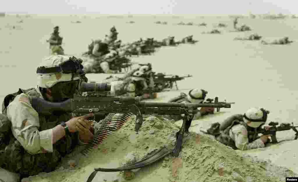 U.S. soldiers take up positions after Iraq fired missiles into Kuwait, setting off ground attack sirens in Kuwait City.