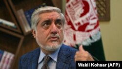 Afghan presidential candidates Abdullah Abdullah gestures as he speaks during an interview with AFP at the Sapedar Palace in Kabul on November 5.
