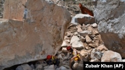 Rescuer workers search for bodies at mine collapse in 2020. Compromised safety conditions and a lack of proper training for mine workers result in frequent accidents.