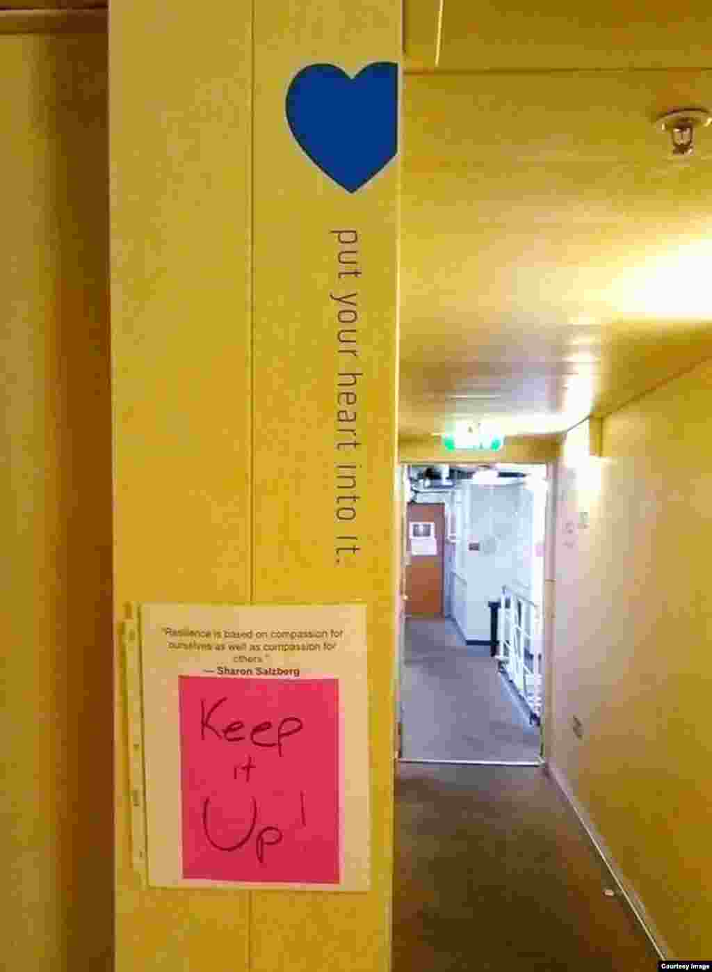 One of several printed quotes that have been pasted around the vessel since the quarantine began, saying, "Resilience is based on compassion for ourselves as well as compassion for others."