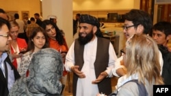 The spokesman for the Taliban in Qatar, Suhhail Shaheen, attends the Intra Afghan Dialogue talks in Doha on July 8.